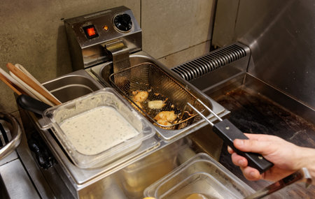 Chef is making nuggets, cheap fast food restaurant