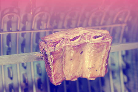 Pork ribs cut on old style electric grill, toned imageの写真素材