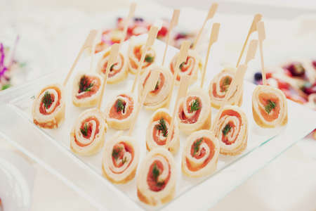 Rolled pancakes with smoked salmon, selective focusの写真素材