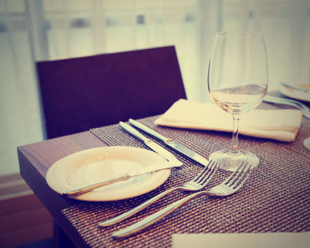 Place setting in a restaurant, toned imageの写真素材