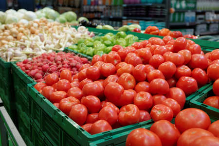 Vegetables inside plastic crates in a supermarketの写真素材