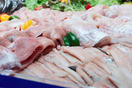 Fish fillets on ice in big food product storeの写真素材