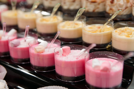 Pink panna cotta and creme brulee on restaurant table