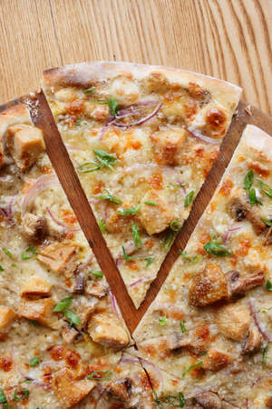 Pizza with porcini (cep) mushrooms, onion and leek shot from aboveの写真素材