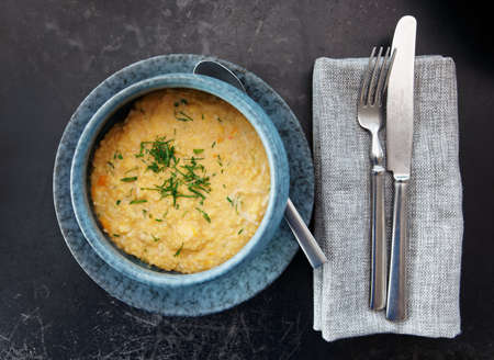 Millet cereal in stoneware bowl shot from above, Russian cuisine dishの写真素材