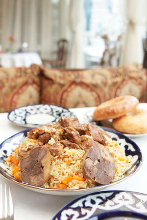 Middle Eastern pilaf rice in plate on restaurant tableの写真素材