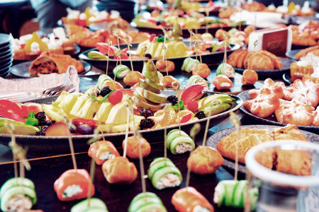 A lot of various food on catering table, self service restaurant or hotel breakfast, toned image