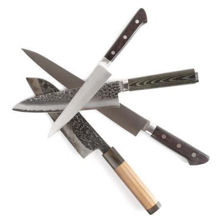 Old and new knives shot on white surfaceの写真素材