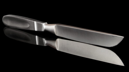 Liston amputation knife, surgical tool, isolated on black with reflection