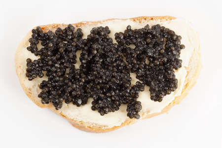 Real, not imitated, beluga caviar on bread with butter, shot from aboveの写真素材