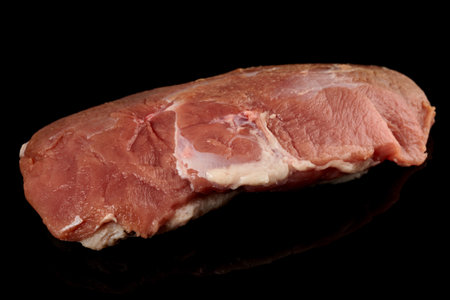 Lean duck fillet isolated on black backgroundの写真素材