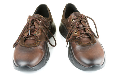 Classic brown men's leather shoes isolated on white backgroundの写真素材
