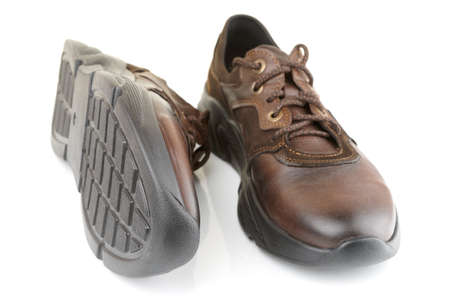 Pair of brown leather shoes on white backgroundの写真素材