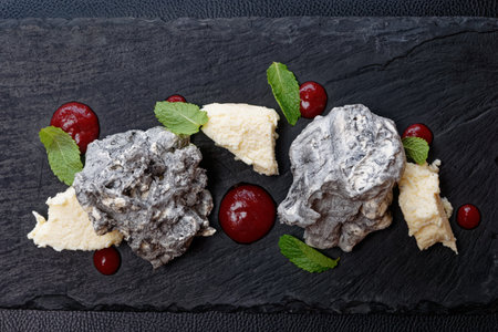 Stone-like dessert on slate plate shot from aboveの写真素材