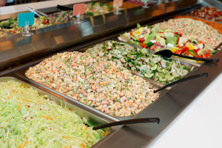 Various salads in gastronomic containers, food store