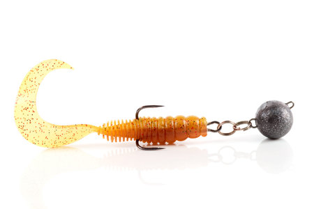 Soft fishing bait, silicone grub, with double hook and lead sinker, isolated on white background