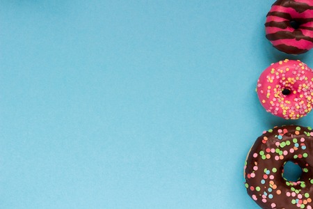 Sweet donuts on the blue background. Delicious donut.の写真素材