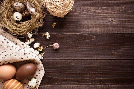 Happy easter. Easter eggs and easter decoration on the wooden table, with copy space.の写真素材