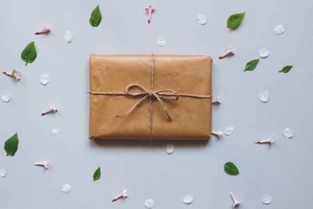 Cute gift box wrapped with craft paper top view. Gift for any holiday.の写真素材
