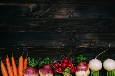 Organic vegetables background. Fresh harvested vegetables on the dark wooden background, top view,...