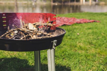 Empty charcoal grill with smoke closeup. Barbecue outdoorの写真素材