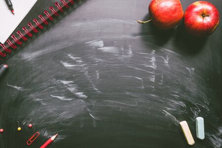 Back to school. School supplies on the chalkboard background with copy space.の写真素材