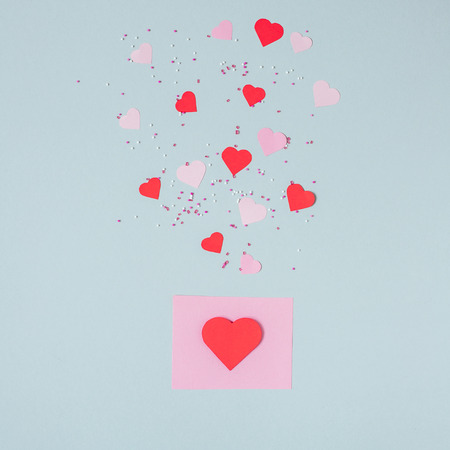 Valentines day background. Valentine card with paper hearts on the blue background.の写真素材