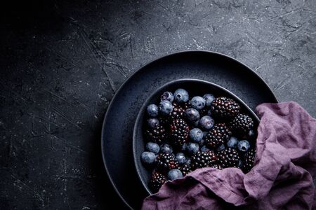 Fresh summer berries in bowl close up.の写真素材