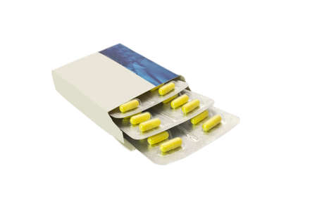 Tablets in a package, isolated on white backgroundの写真素材