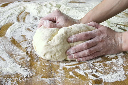 Dough Mix hands on the deskの写真素材