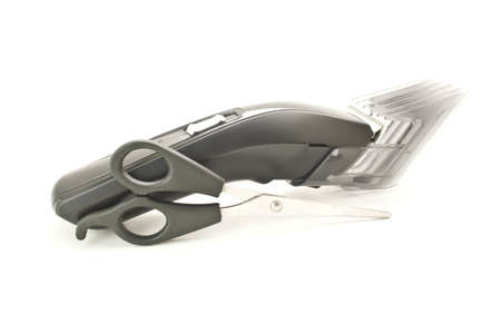Scissors and clipper isolated on white backgroundの写真素材