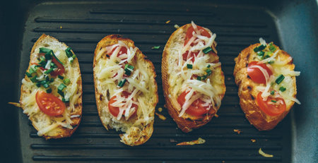 bread grilled with cheese, onions and tomatoes