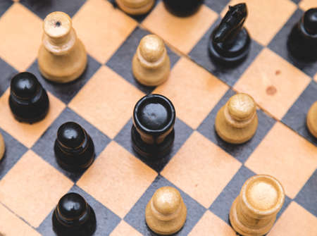 Vintage wooden chess on the chess board closeupの写真素材