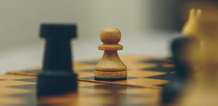 Vintage wooden chess on the chess board closeupの写真素材