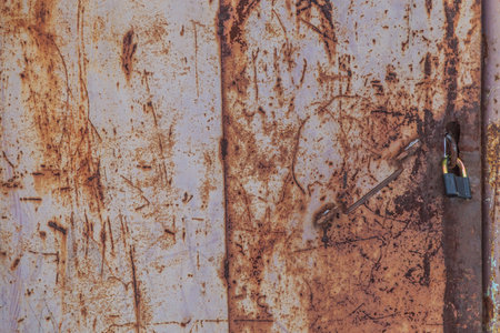 old rusty metallic background on the street in winter