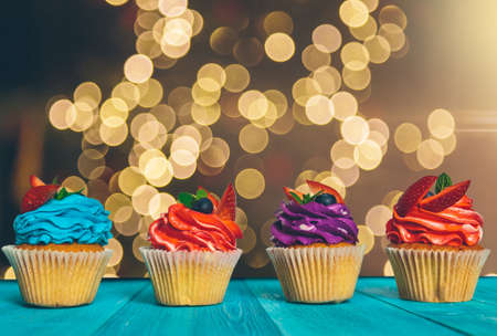 cupcake on wooden table on light backgroundの写真素材