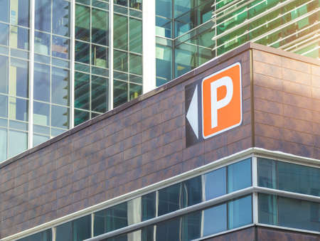 Modern office building with parking pointer afternoonの写真素材