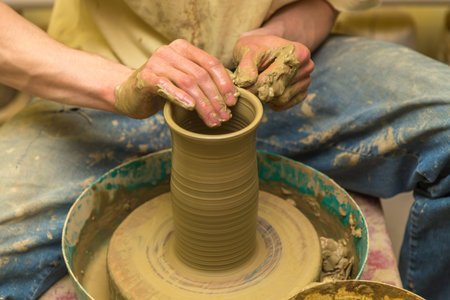 the potter makes earthen vessel close up