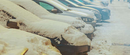 Parking used cars in winter on the streetの写真素材