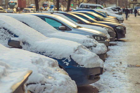 Parking used cars in winter on the streetの写真素材