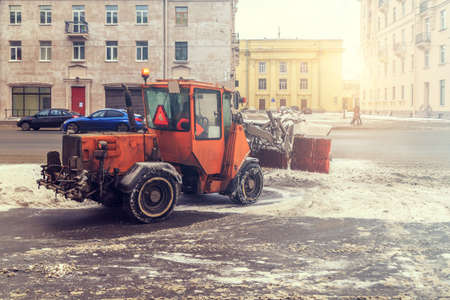 Snow removal vehicles in the street in winterの写真素材