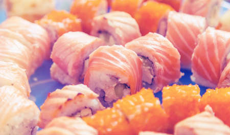 sushi rolls close up on a blue backgroundの写真素材