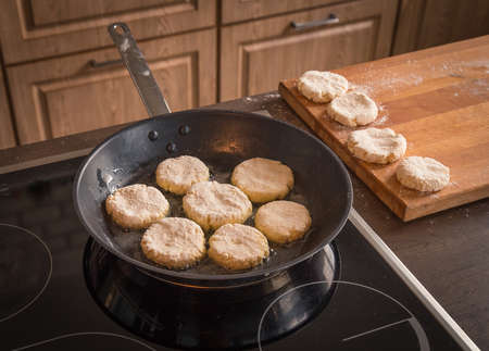 Pancakes are fried in a frying pan close upの写真素材