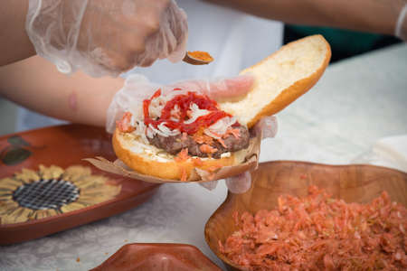 cooking burger on the street close upの写真素材