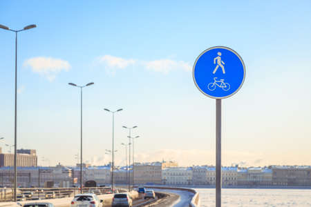 a sign of a bicycle path in the city in winterの写真素材