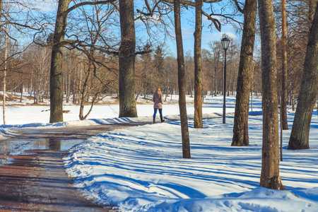 people are walking in the spring park in Russia
