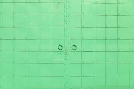 the old iron green gate close upの写真素材