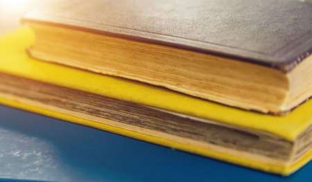 several ancient books close-up on each otherの写真素材