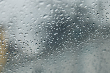 raindrops on the glass close up in springの写真素材