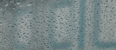 raindrops on the glass close up in spring